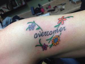 Mel's tattoo 4 flowers